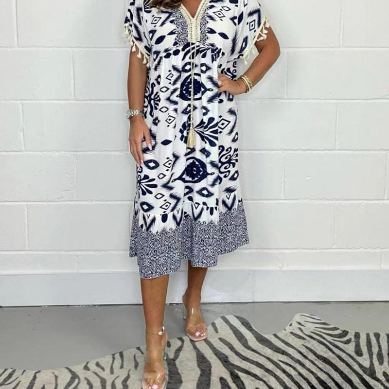 Juline - Robe décontractée imprimée avec décolleté en V et franges sur les manches courtes