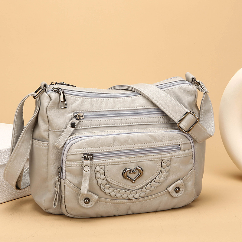 Quixelle - Sac bandoulière femme en cuir PU souple avec multiples poches